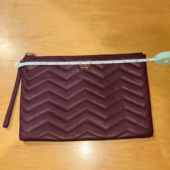 kate spade Handbags - Kate Spade Burgundy Wristlet